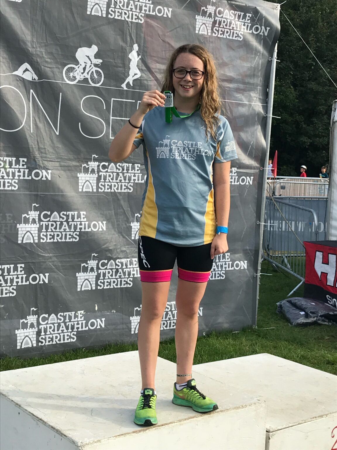 Mia with her medal at a Castle Triathlon Series event